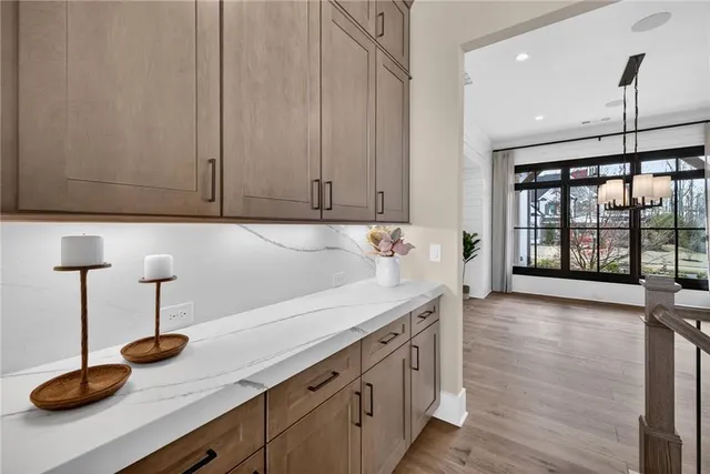 a kitchen with stainless steel appliances granite countertop a stove sink and cabinets