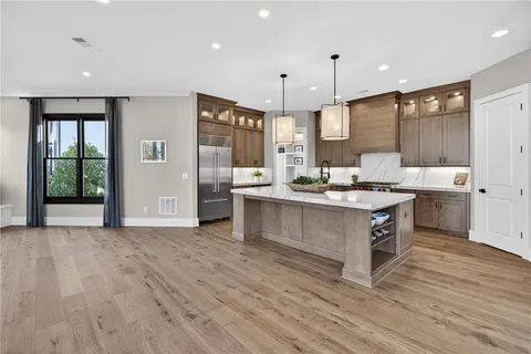 a view of living room with a flat screen tv and a fireplace