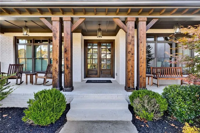 a view of hallway with stairs and wooden floor