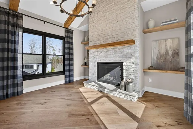 a bathroom with a toilet sink vanity tub and mirror
