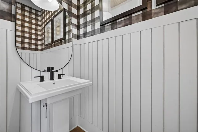 a view of an empty room with a fireplace and a window