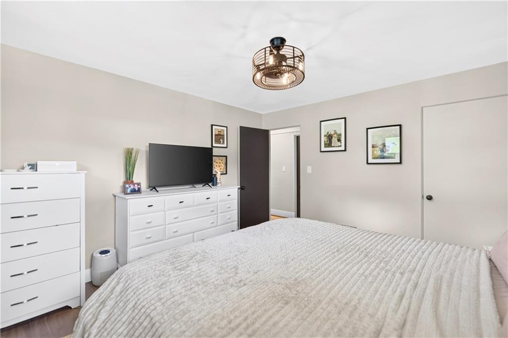 1642 Rostraver Road Belle Vernon, PA 15012 - Photo 15 of 32 a bedroom with a bed and a television