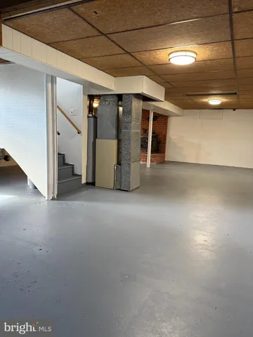 a view of empty room with stairs