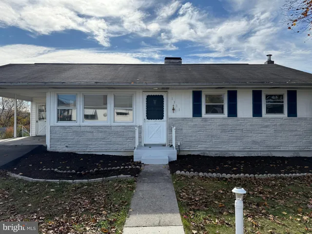 a front view of a house with yard
