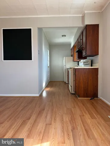 a view of a kitchen with a sink and cabinets