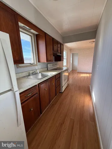 a bathroom with a sink and a large mirror