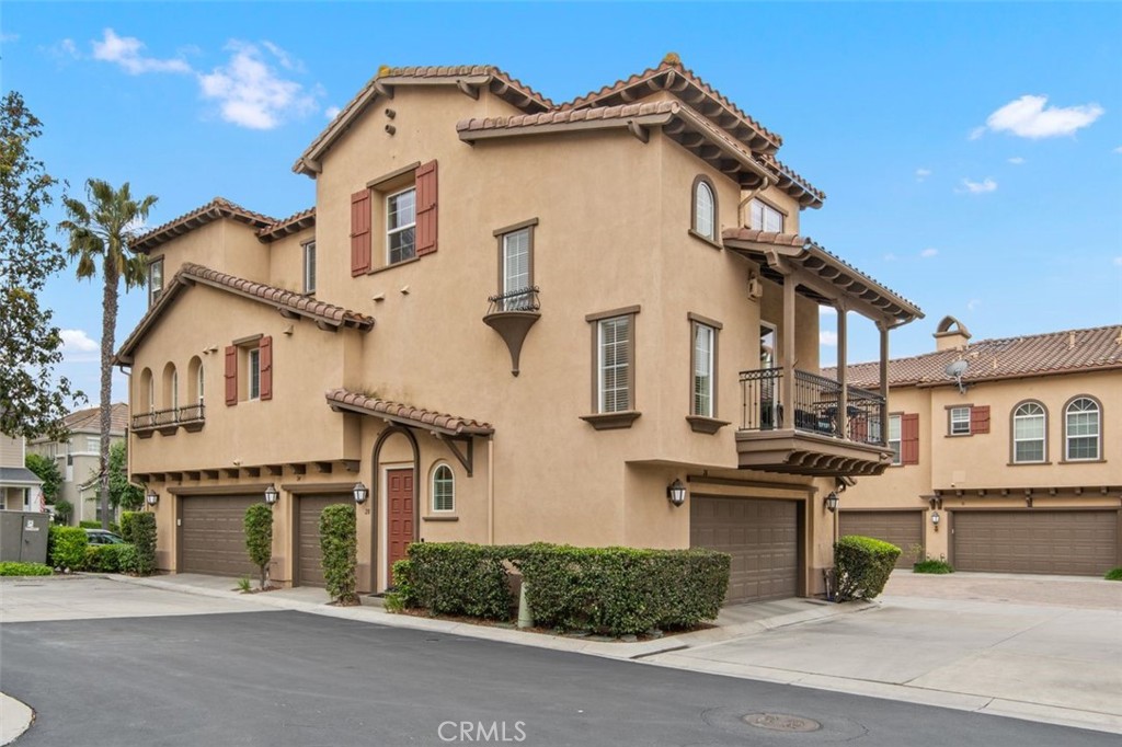 28 Dietes Court Ladera Ranch, CA 92694 - Photo 1 of 1 a view of a white house with large windows and a small yard