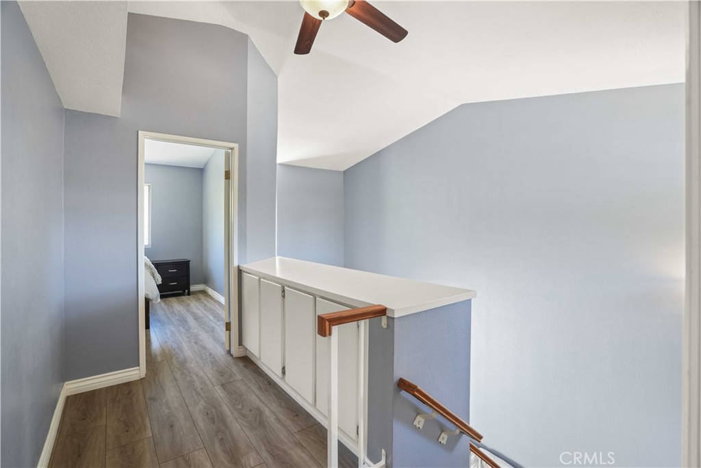 28345 Seco Canyon Road, Unit 97 Saugus, CA 91390 - Photo 17 of 38 a view of a hallway with wooden floor and entryway