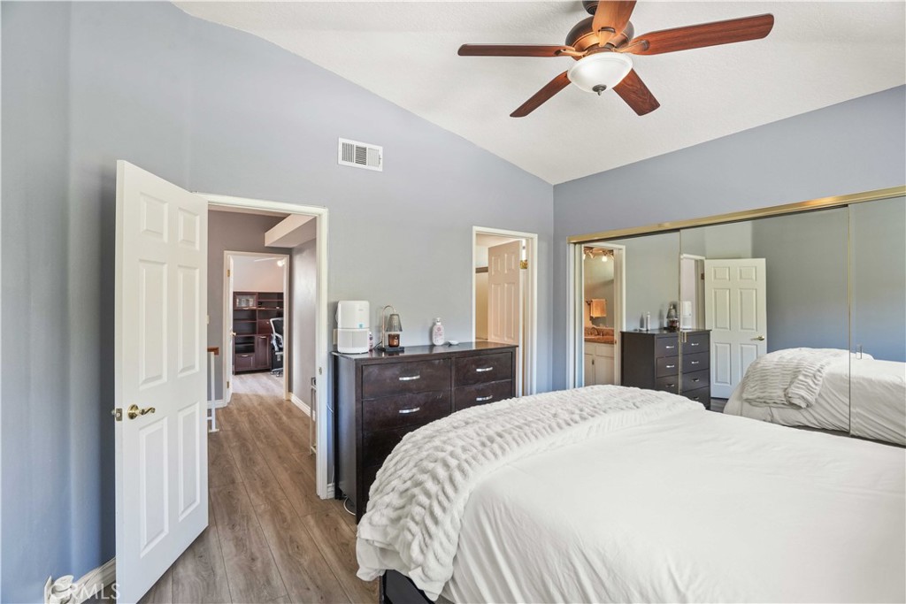 28345 Seco Canyon Road, Unit 97 Saugus, CA 91390 - Photo 19 of 38 a bedroom with a bed and a chandelier