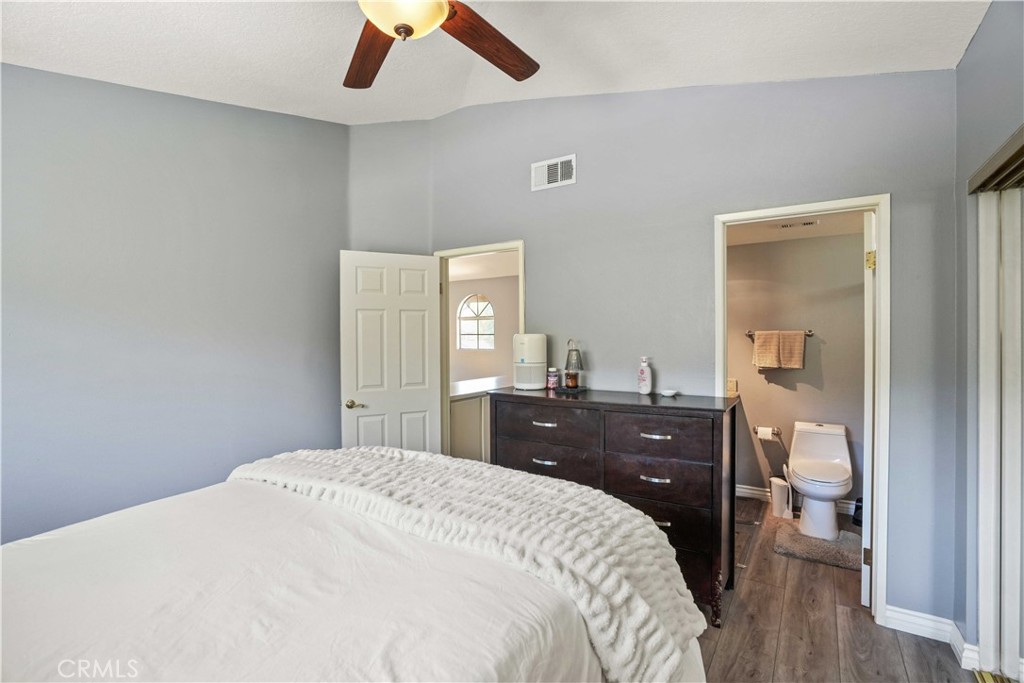 28345 Seco Canyon Road, Unit 97 Saugus, CA 91390 - Photo 20 of 38 a bedroom with a bed and a dresser
