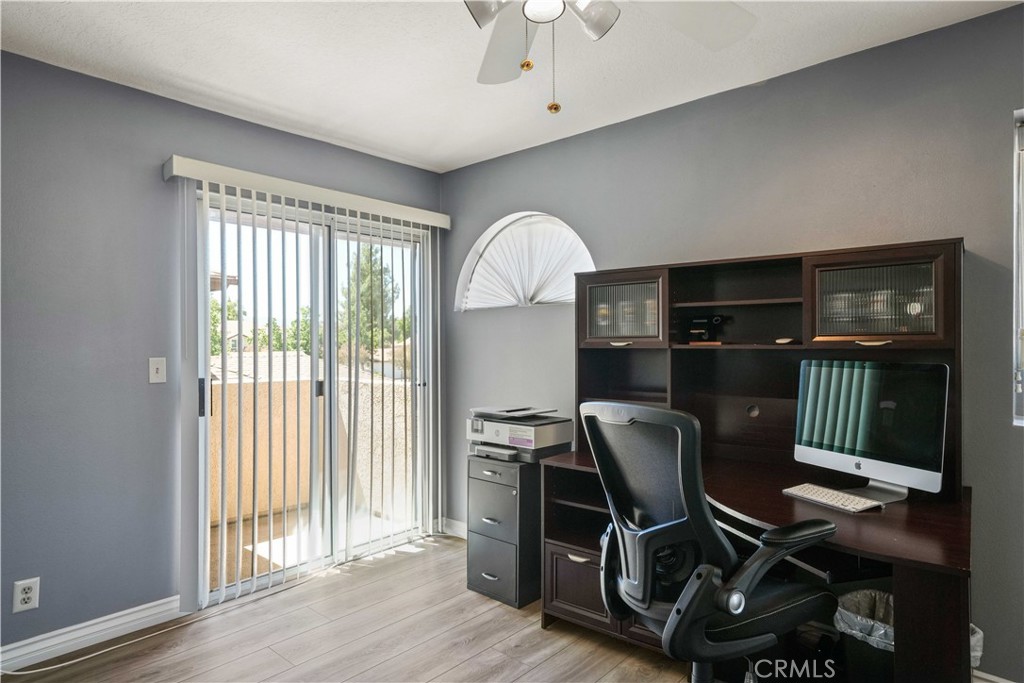 28345 Seco Canyon Road, Unit 97 Saugus, CA 91390 - Photo 23 of 38 a workspace with wooden floor and a window