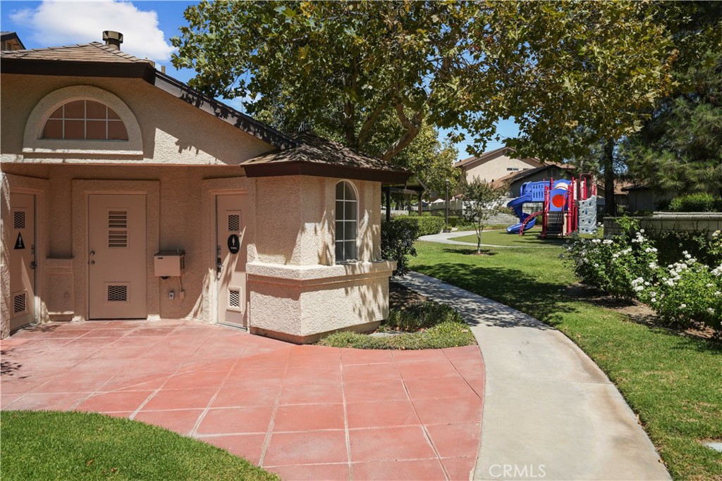 28345 Seco Canyon Road, Unit 97 Saugus, CA 91390 - Photo 32 of 38 a front view of a house with a yard