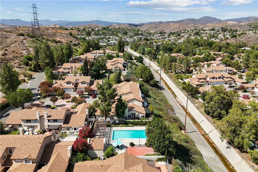 28345 Seco Canyon Road, Unit 97 Saugus, CA 91390 - Photo 34 of 38 an aerial view of residential houses with outdoor space