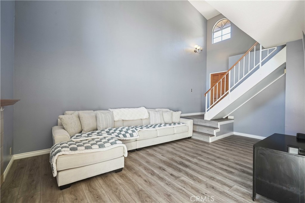 28345 Seco Canyon Road, Unit 97 Saugus, CA 91390 - Photo 6 of 38 a living room with furniture and a wooden floor