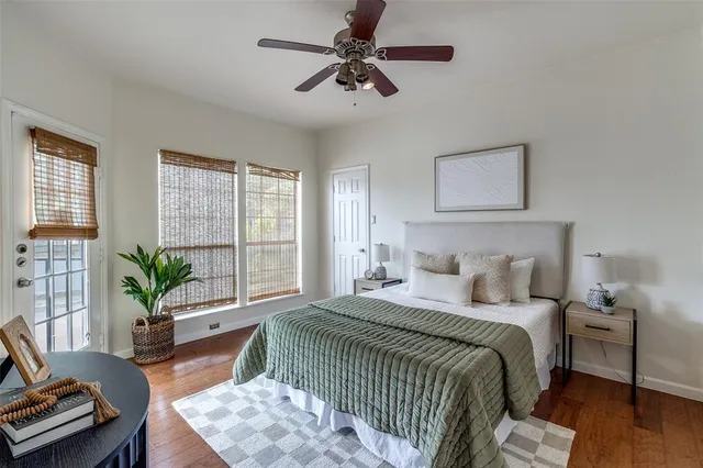 a bedroom with a balcony a bed and a couch