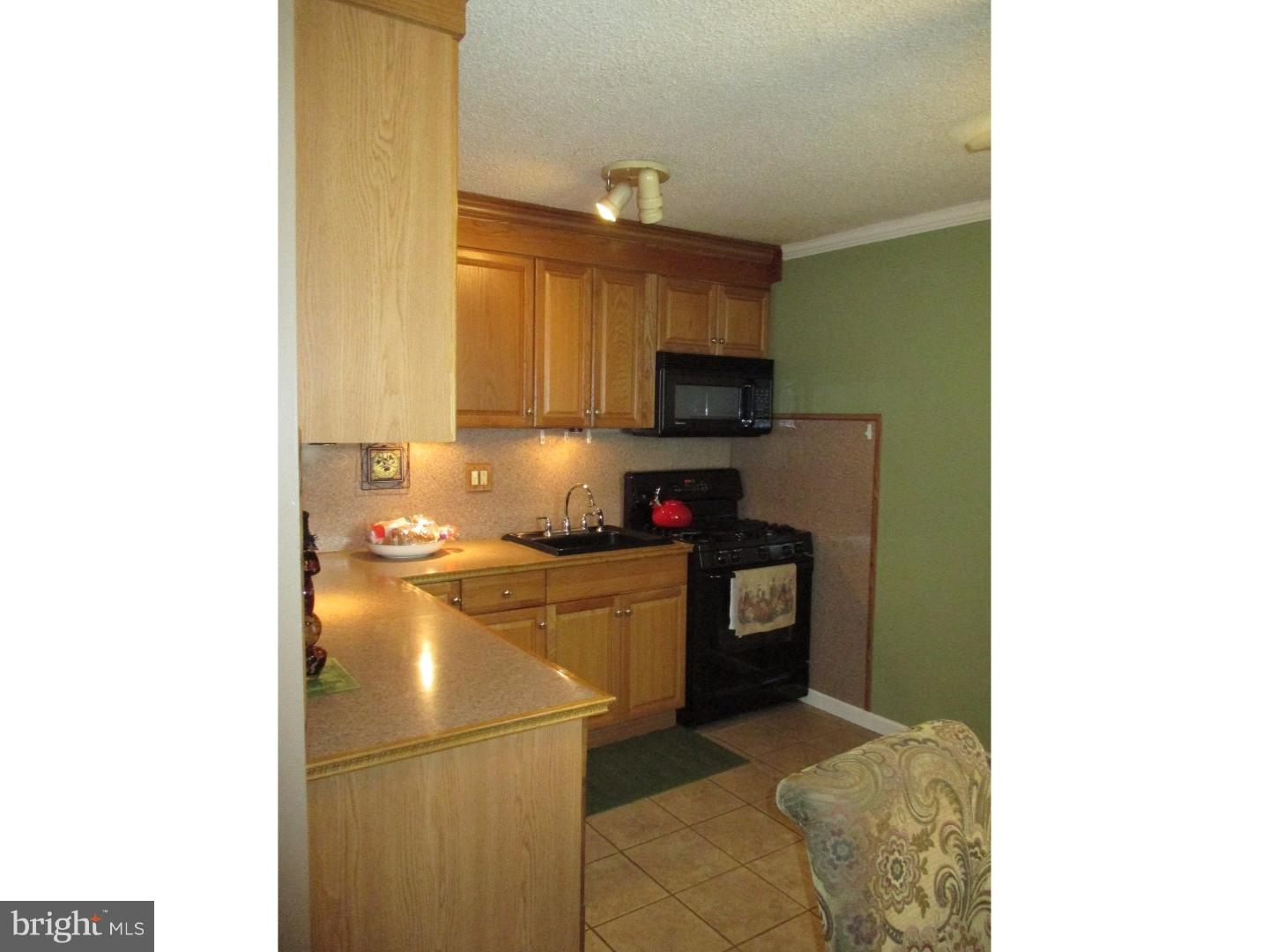 3105 Byberry Road Philadelphia, PA 19154 - Photo 3 of 7 a kitchen with a refrigerator and a stove