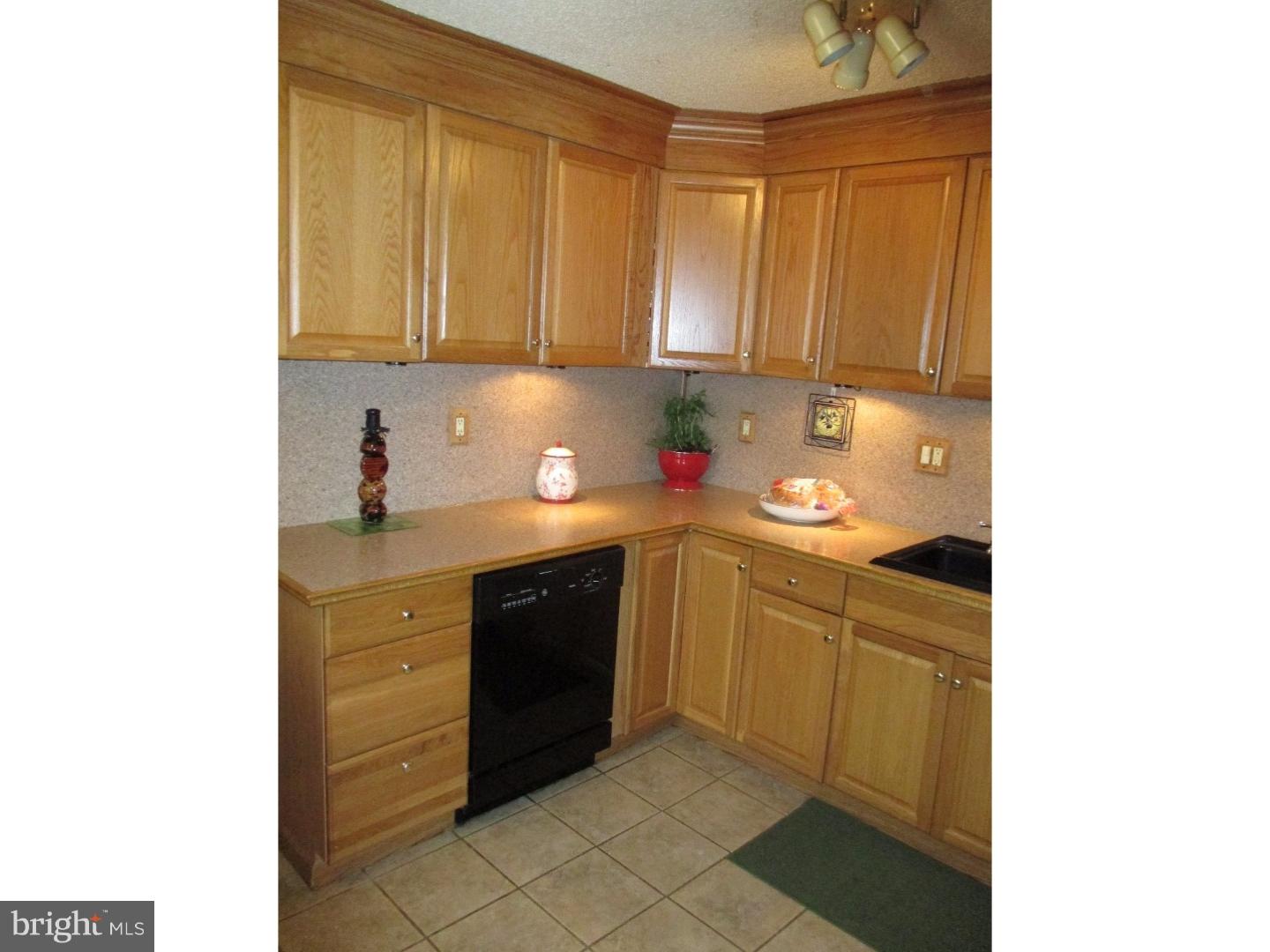 3105 Byberry Road Philadelphia, PA 19154 - Photo 4 of 7 a kitchen with a sink and cabinets
