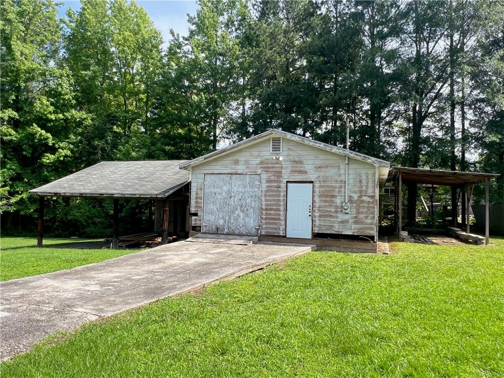 340 Womack Avenue Dallas, GA 30157 - Photo 5 of 29 a view of a house with a yard