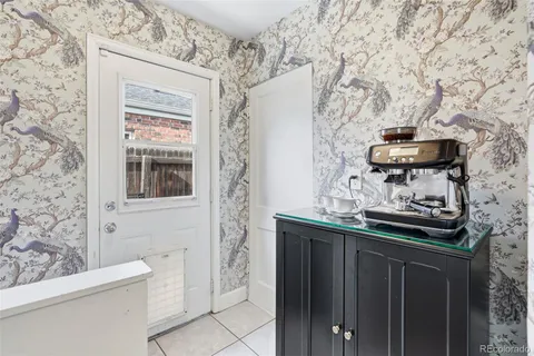 a bathroom with a granite countertop sink a toilet and shower