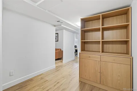 a view of walk in closet with empty racks