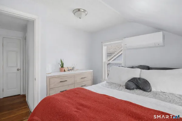 a bedroom with a bed and a cabinets