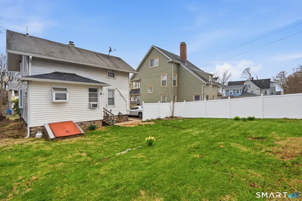a front view of house with yard and play ground