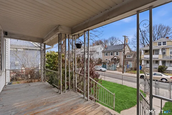 a view of a porch with furniture