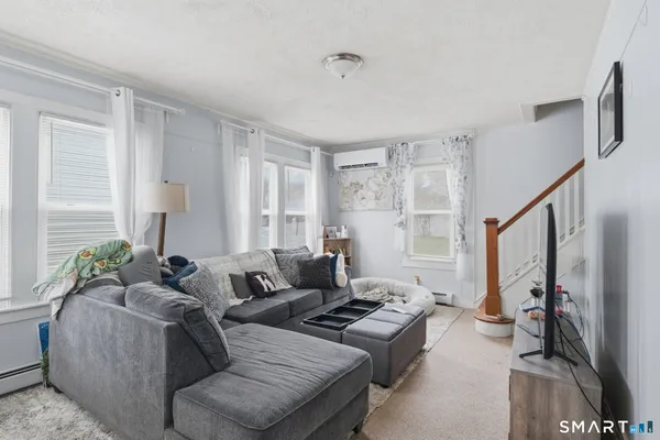 a living room with furniture and a window