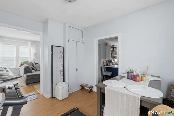 a dining room with a table and chairs