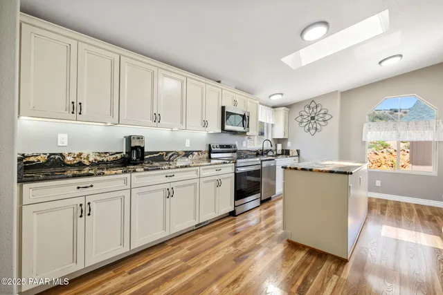 a view of living room with granite countertop furniture and fireplace
