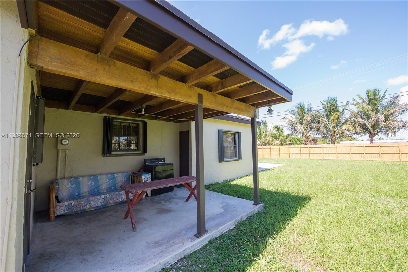 18900 Southwest 313th Street Homestead, FL 33030 - Photo 21 of 40 a view of swimming pool with a patio and a yard