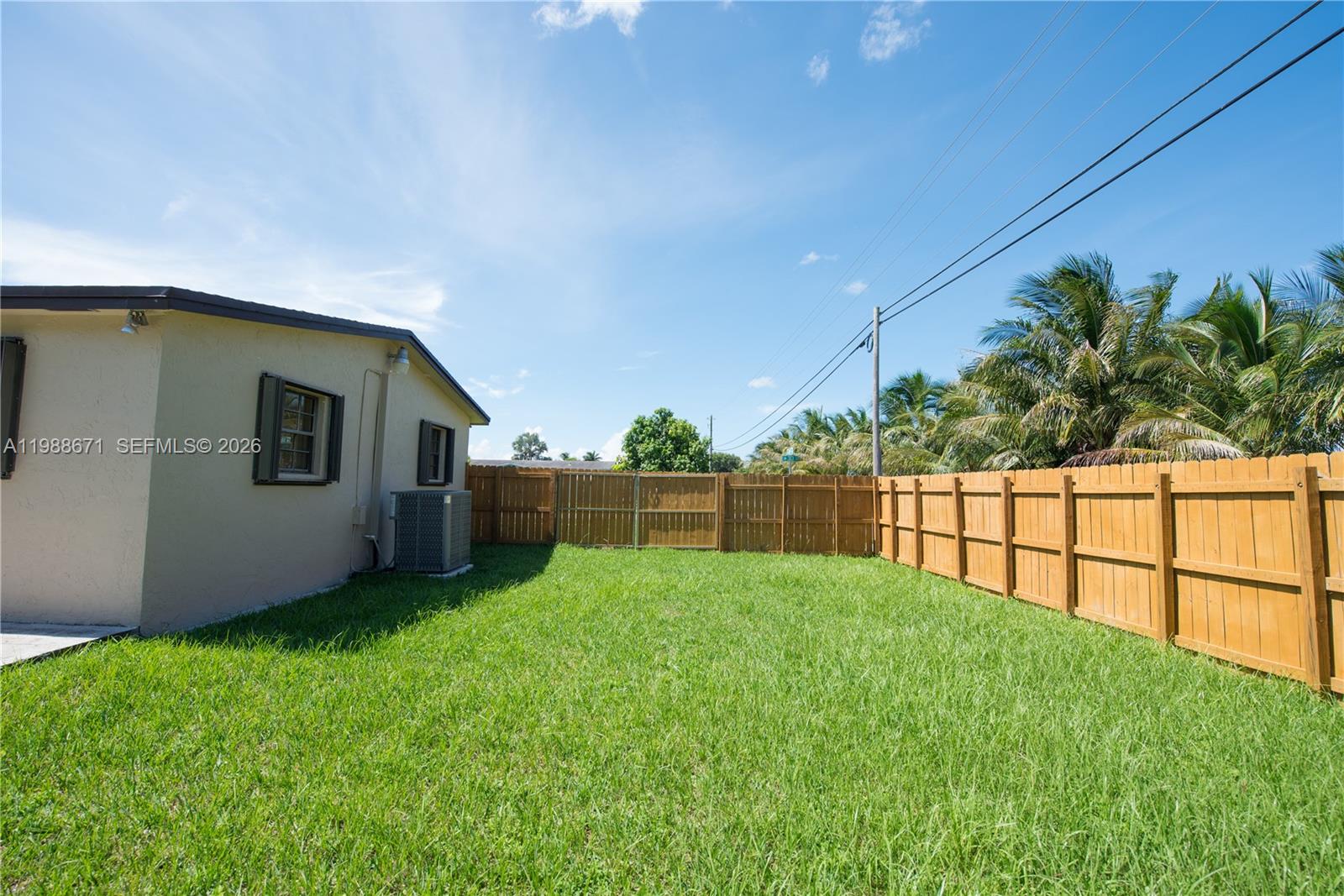 18900 Southwest 313th Street Homestead, FL 33030 - Photo 25 of 40 a backyard of a house with lots of green space