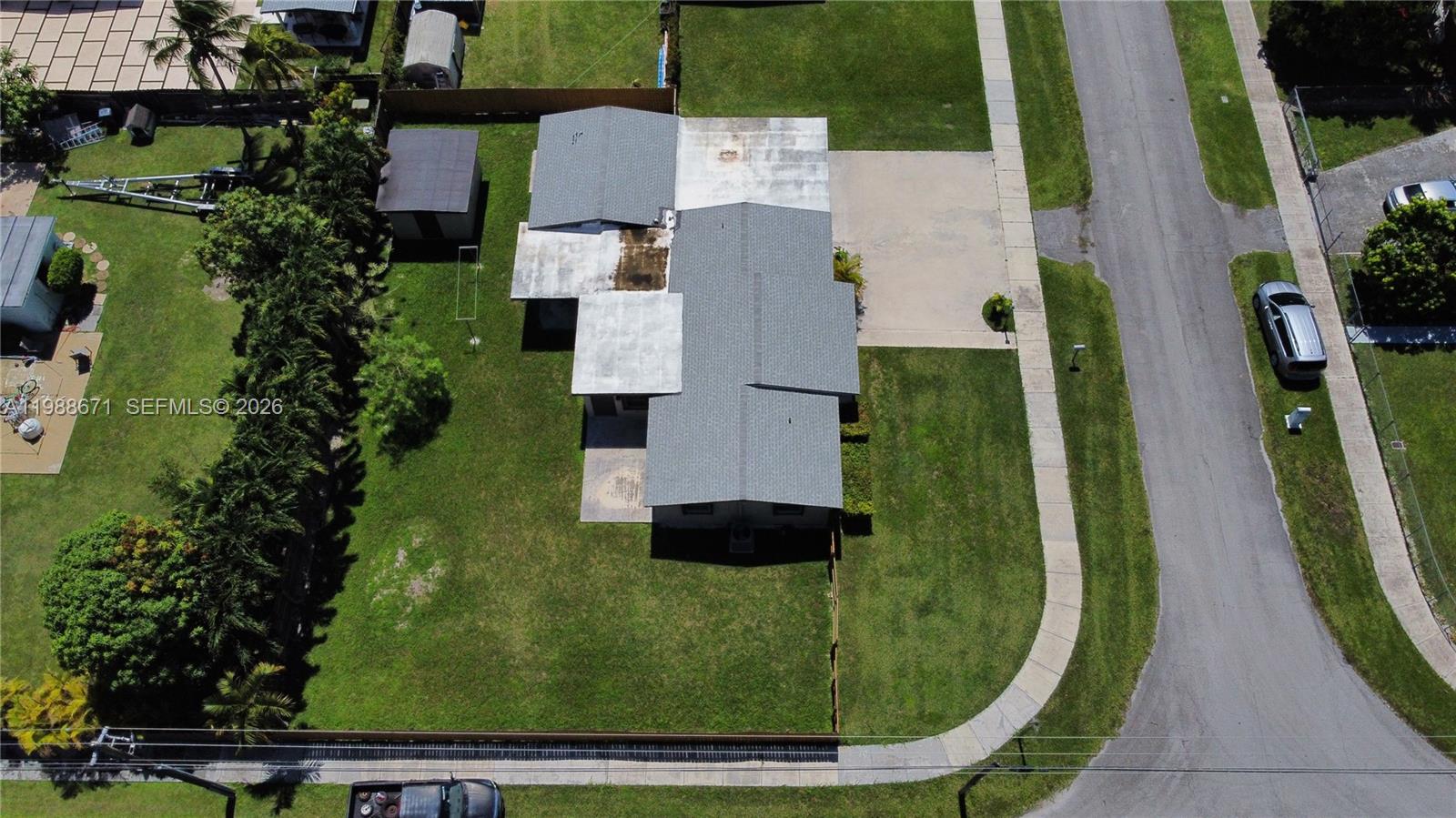 18900 Southwest 313th Street Homestead, FL 33030 - Photo 29 of 40 an aerial view of a residential houses with outdoor space and a lake view