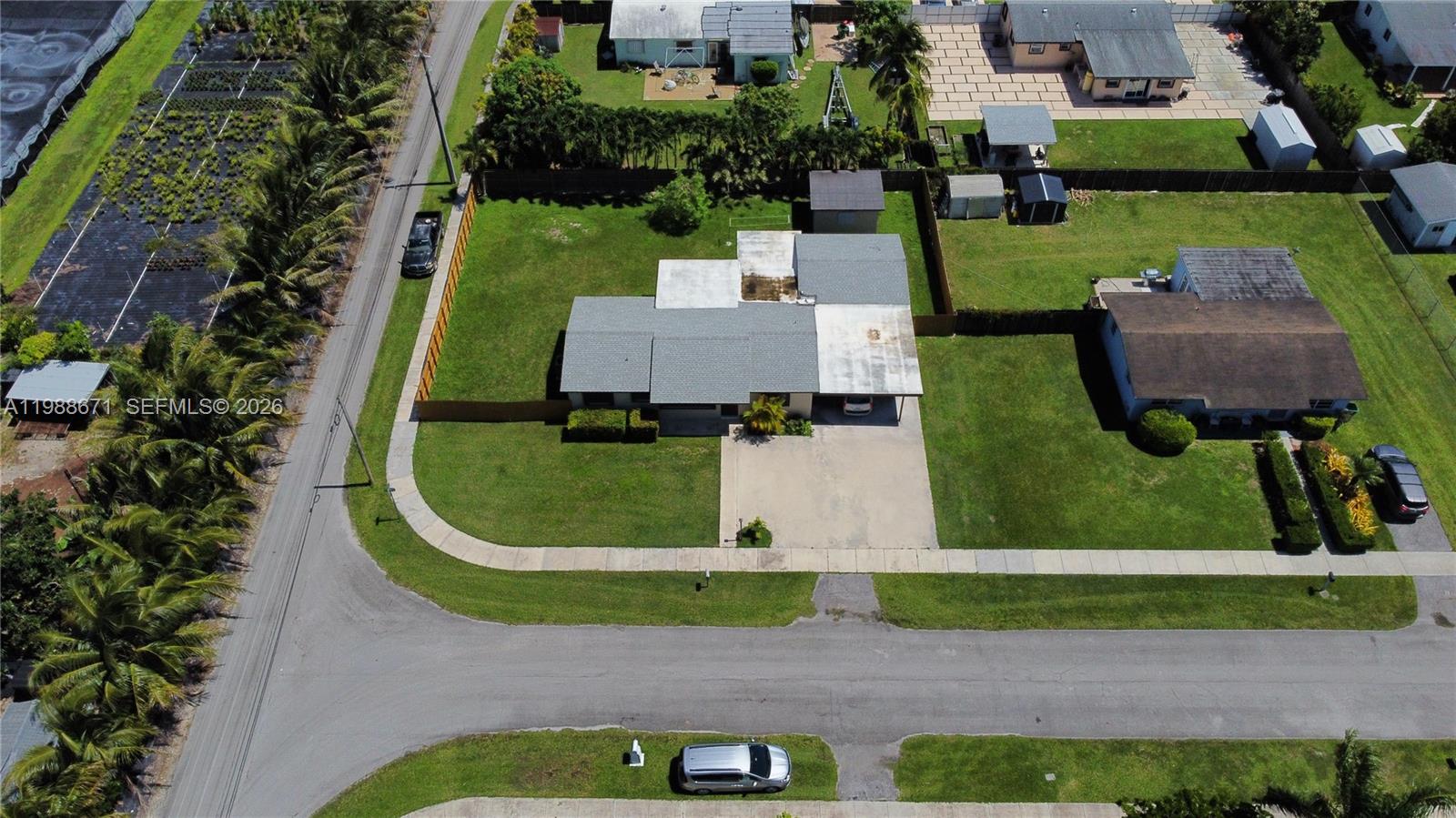 18900 Southwest 313th Street Homestead, FL 33030 - Photo 31 of 40 an aerial view of a house with swimming pool and garden