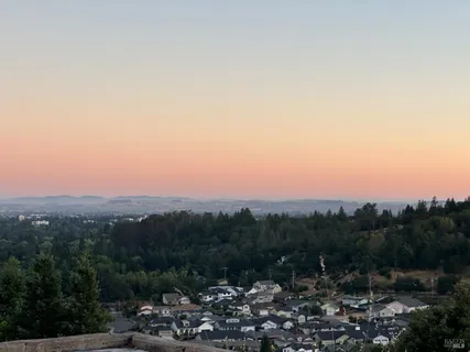 a view of a town with mountains in the background