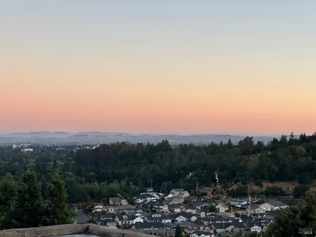 a view of a town with mountains in the background