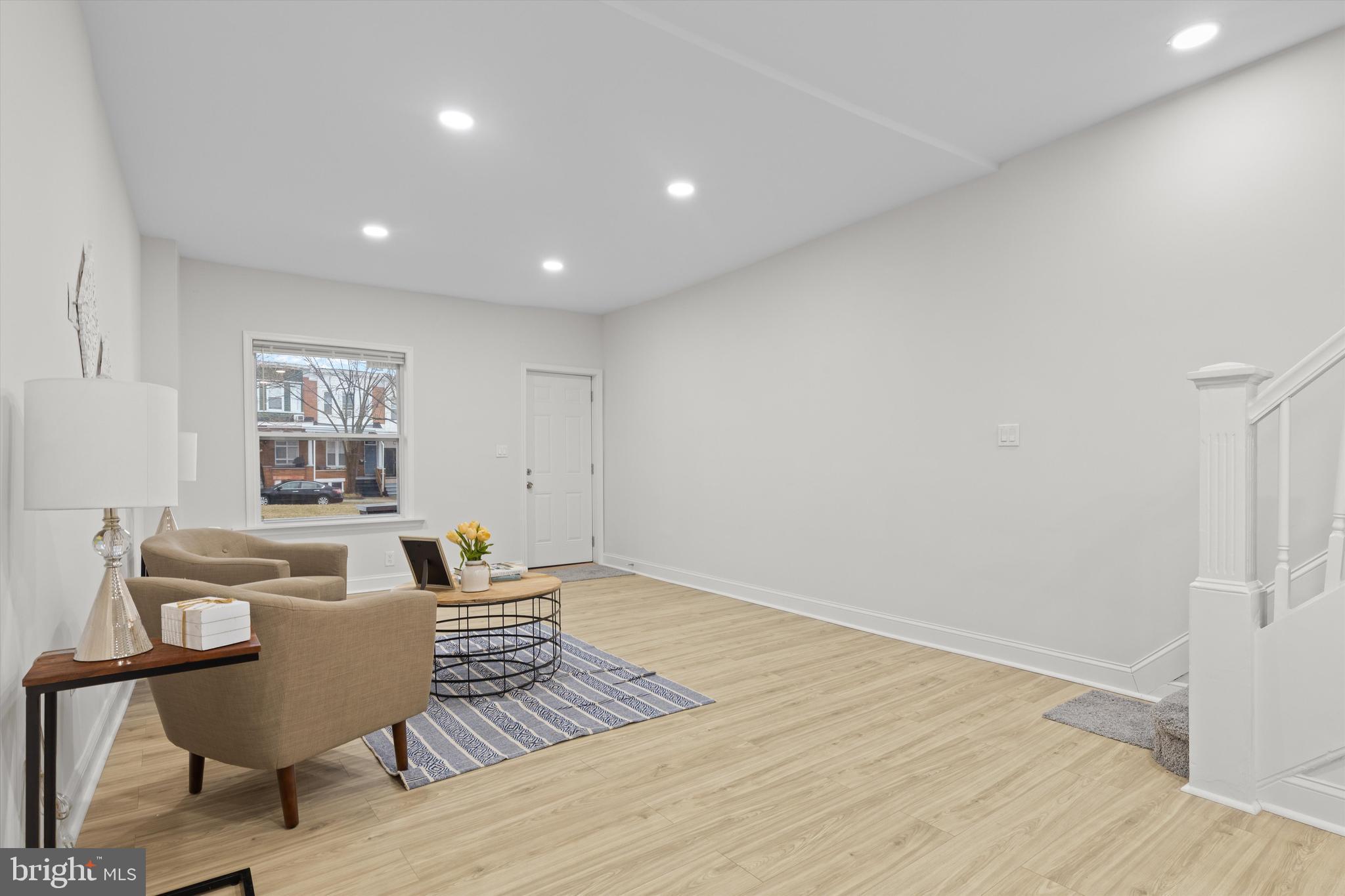 2816 The Alameda Baltimore, MD 21218 - Photo 5 of 20 a living room with furniture and wooden floor