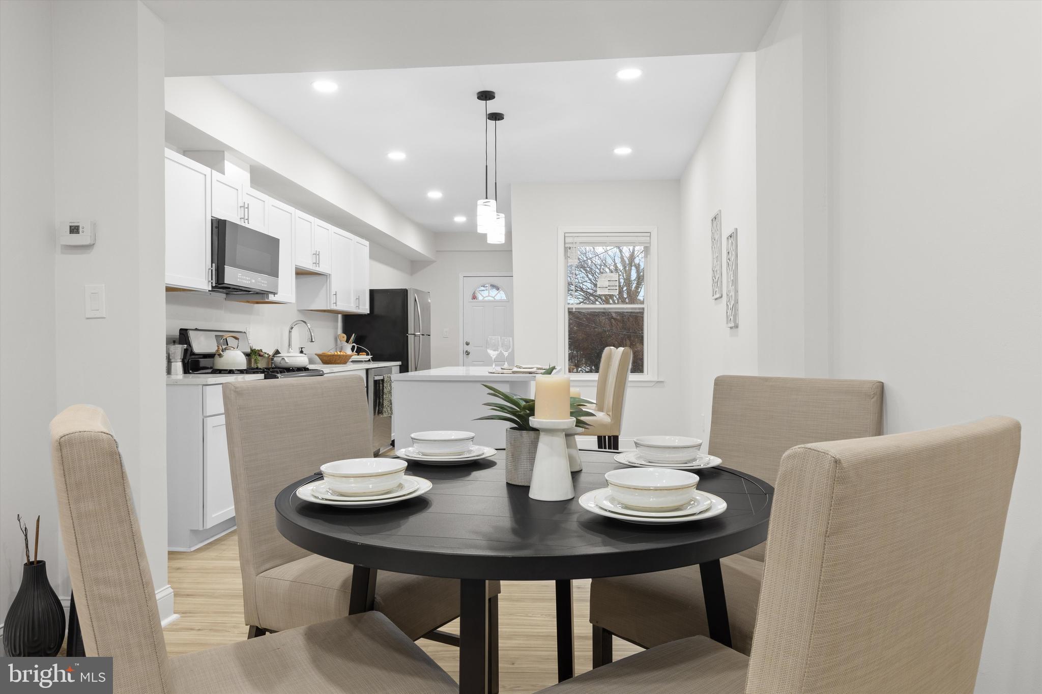 2816 The Alameda Baltimore, MD 21218 - Photo 6 of 20 a view of a dining room with furniture