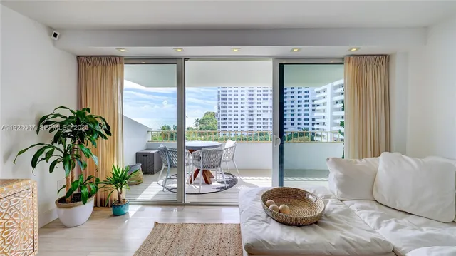 a dining room with furniture window and wooden floor