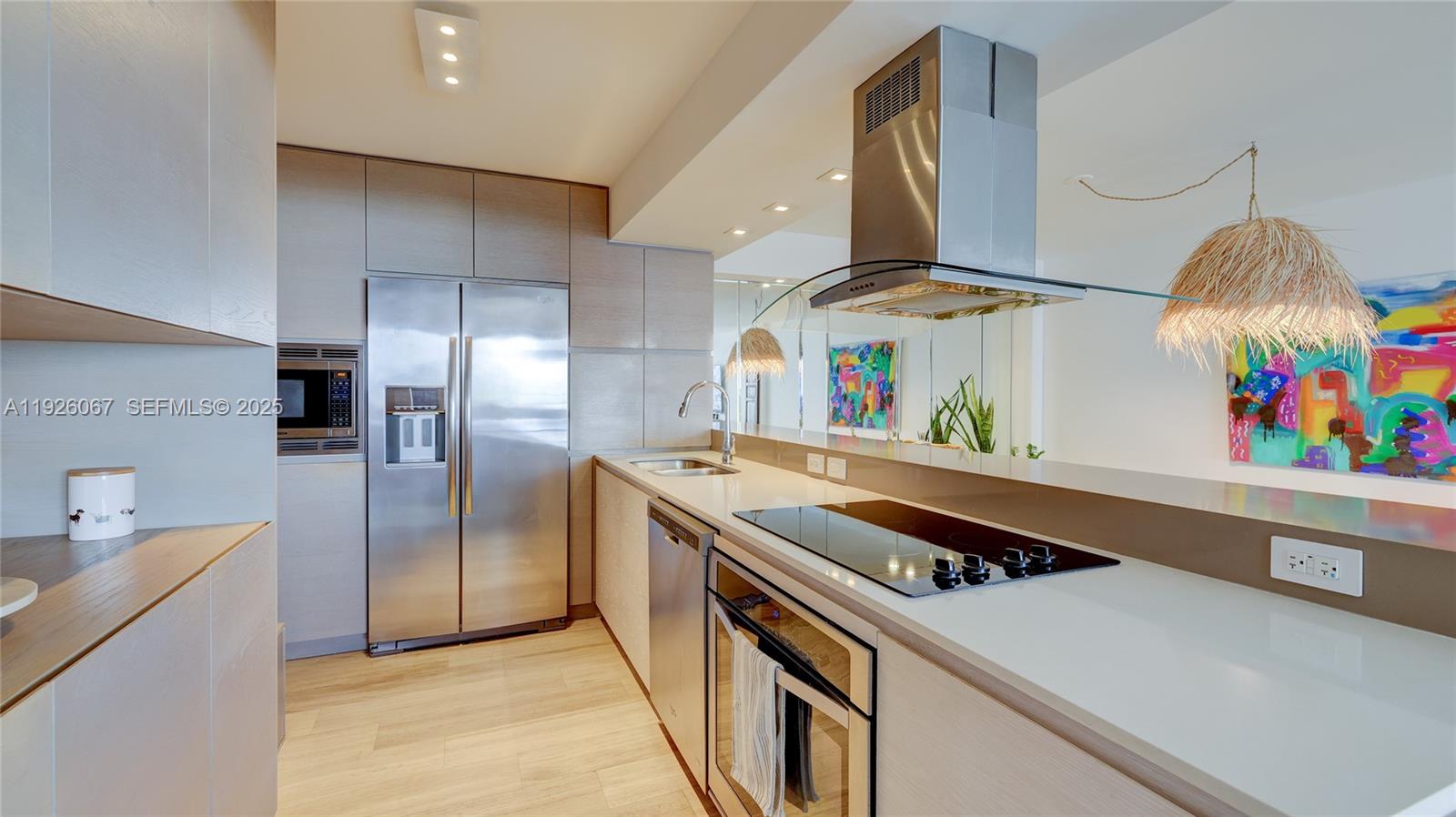 177 Ocean Ln Drive, Unit 707 Key Biscayne, FL 33149 - Photo 15 of 29 a kitchen with stainless steel appliances a stove a refrigerator and a sink