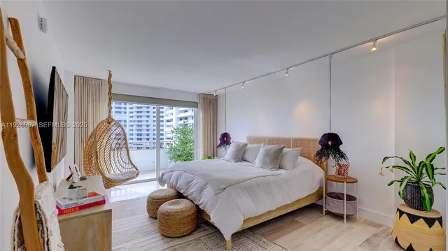a bedroom with a bed and potted plants with wooden floor