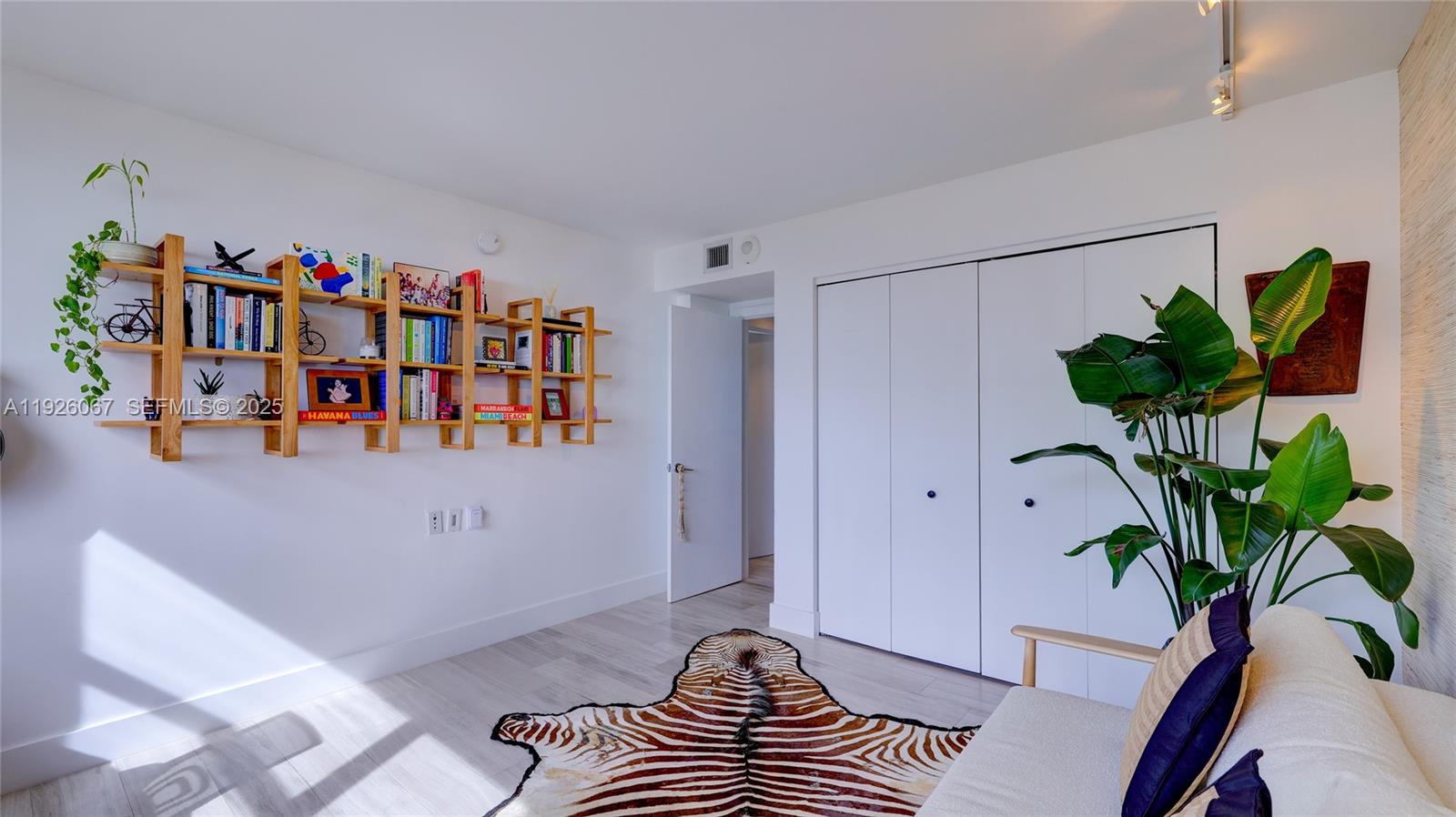 177 Ocean Ln Drive, Unit 707 Key Biscayne, FL 33149 - Photo 26 of 29 a living room with furniture and a potted plant