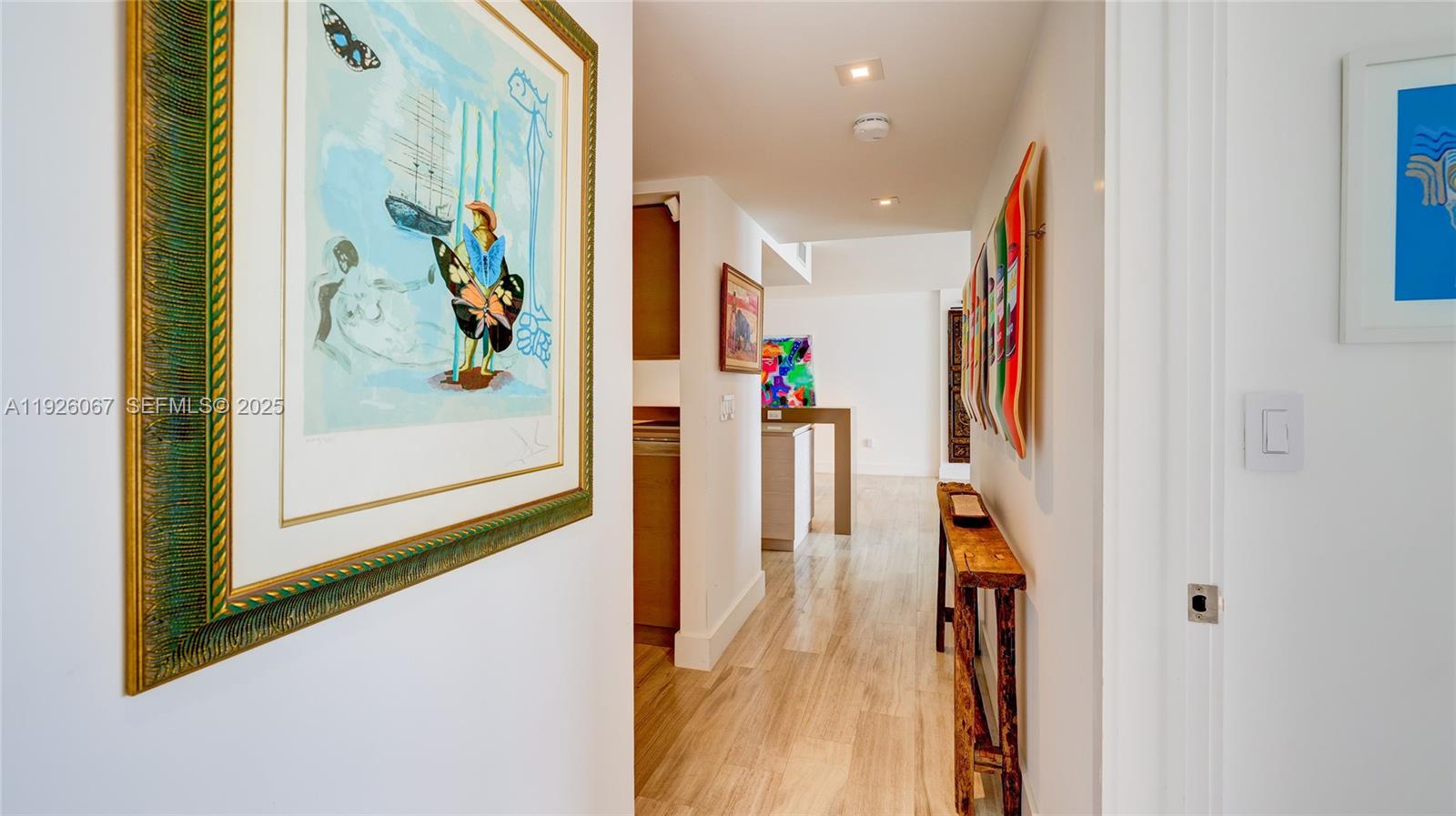 177 Ocean Ln Drive, Unit 707 Key Biscayne, FL 33149 - Photo 3 of 29 a view of a hallway with wooden floor and windows