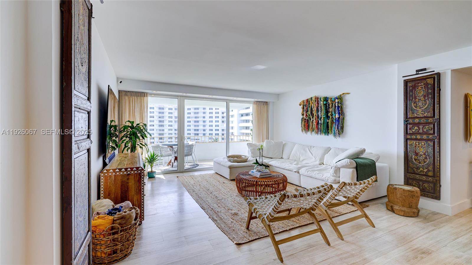 177 Ocean Ln Drive, Unit 707 Key Biscayne, FL 33149 - Photo 7 of 29 a living room with furniture and a potted plant