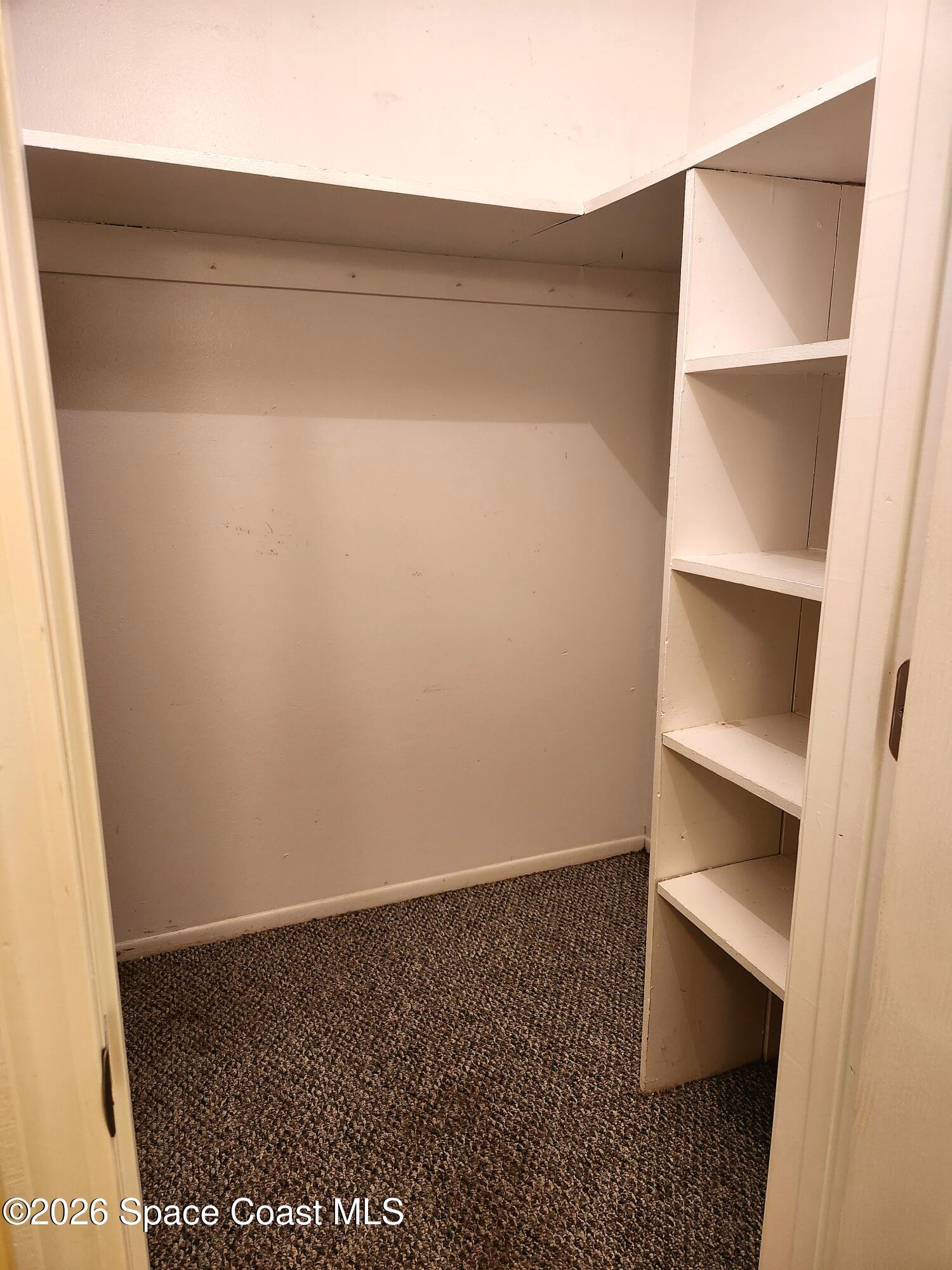 4304 London Town Rd Road, Unit 109 Titusville, FL 32796 - Photo 12 of 13 a view of an empty walk in closet