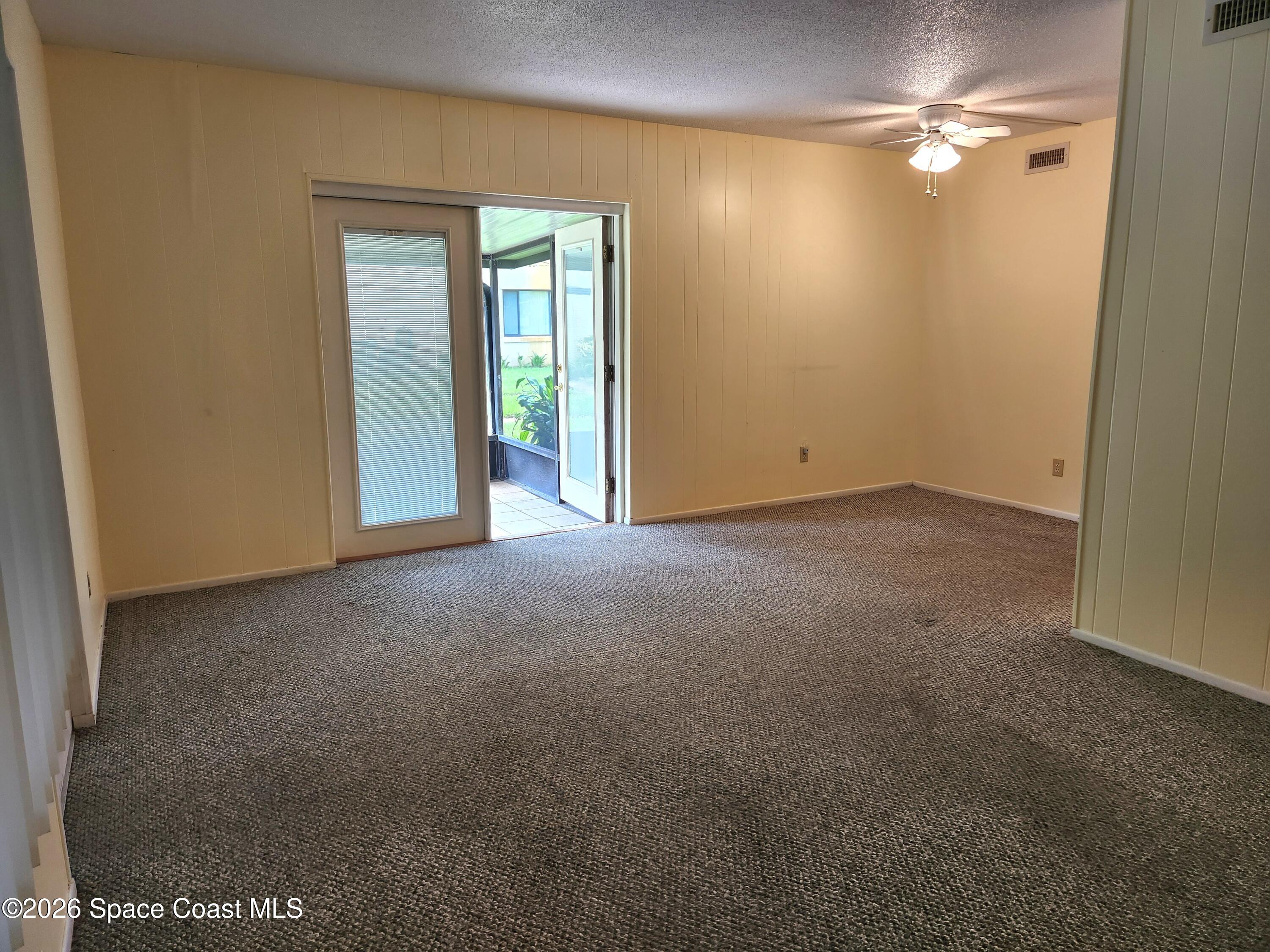 4304 London Town Rd Road, Unit 109 Titusville, FL 32796 - Photo 4 of 13 a view of empty room with fan
