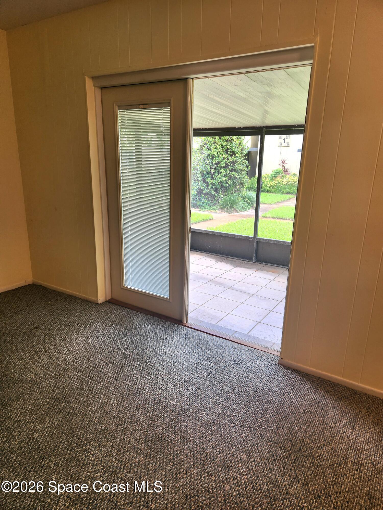 4304 London Town Rd Road, Unit 109 Titusville, FL 32796 - Photo 5 of 13 a view of an empty room with a window