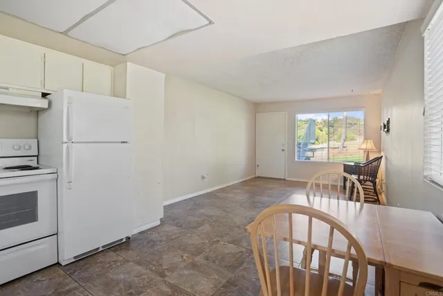 a view of kitchen with furniture and wooden floor
