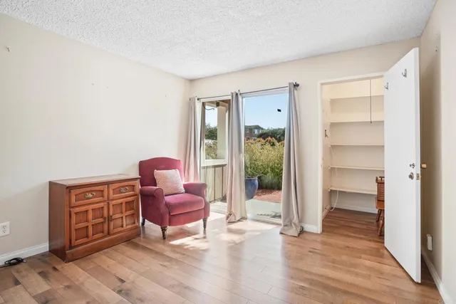 a living room with furniture and a chair