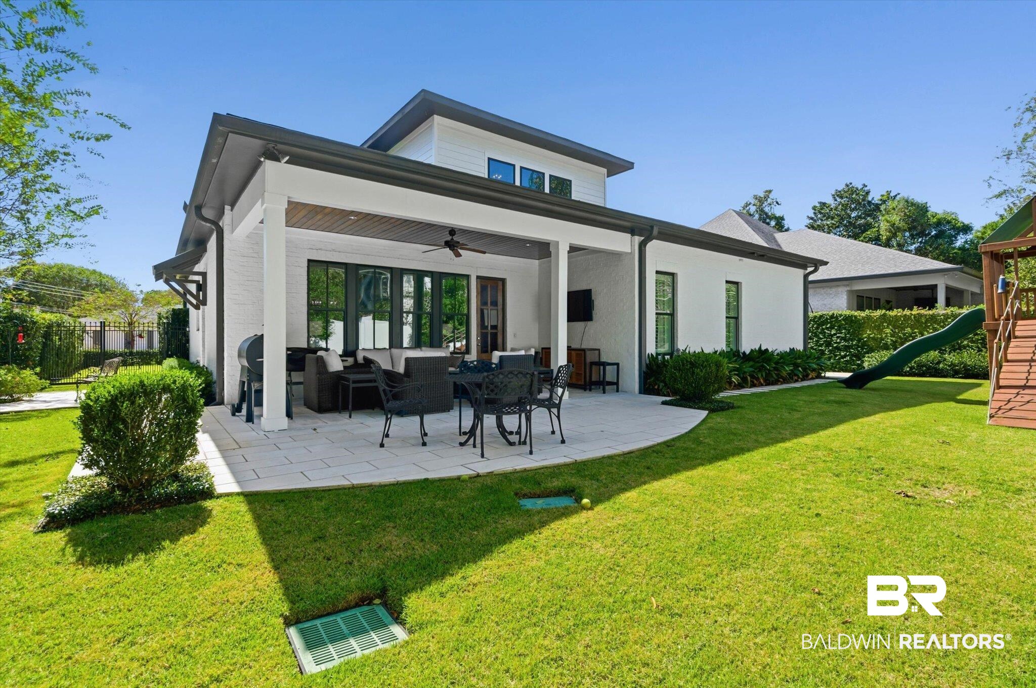 3704 Stein Street Mobile, AL 36608 - Photo 29 of 37 Back of house featuring a ceiling fan, a playground, outdoor lounge area, and a lawn